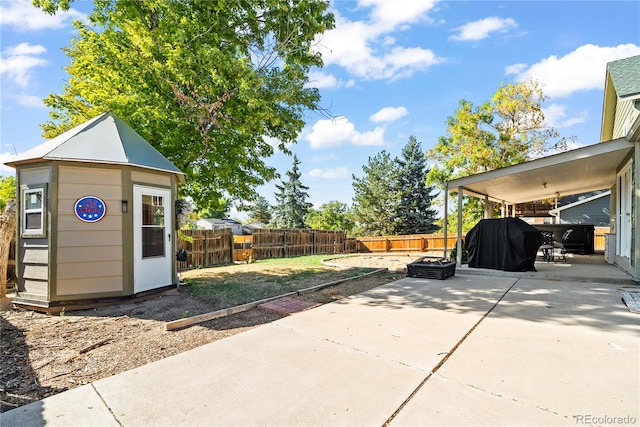 view of patio / terrace featuring a storage unit