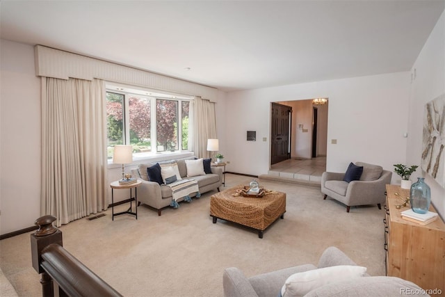 carpeted living area with visible vents