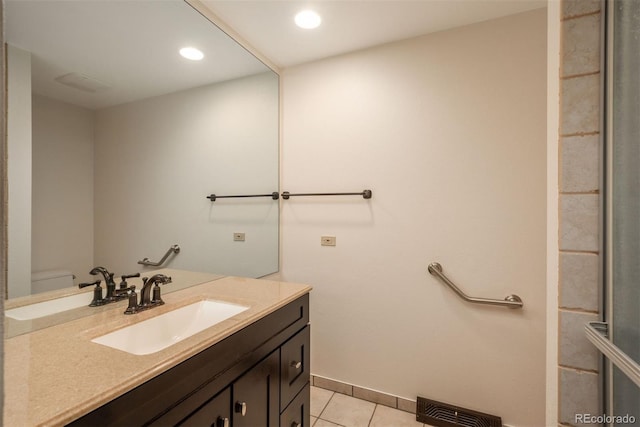 bathroom with visible vents, tile patterned flooring, vanity, baseboards, and recessed lighting