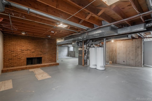 unfinished basement featuring heating unit and water heater
