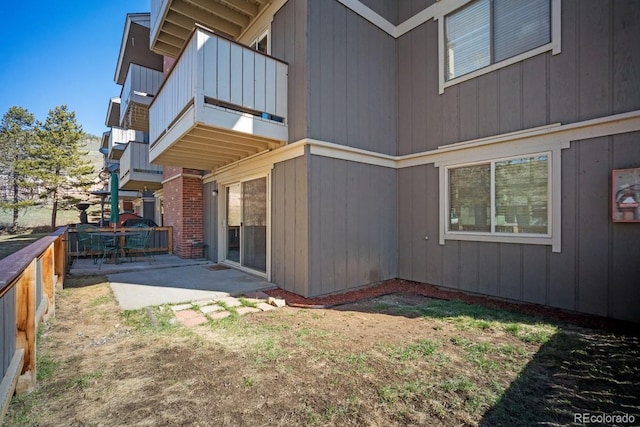 933 Straight Creek Dr Unit 101, Dillon, CO 80435 - back of house with a patio, fence, and a balcony