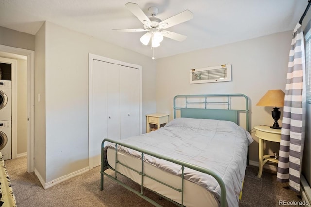 933 Straight Creek Dr Unit 101, Dillon, CO 80435 - bedroom featuring a closet, baseboards, stacked washer / drying machine, and carpet floors