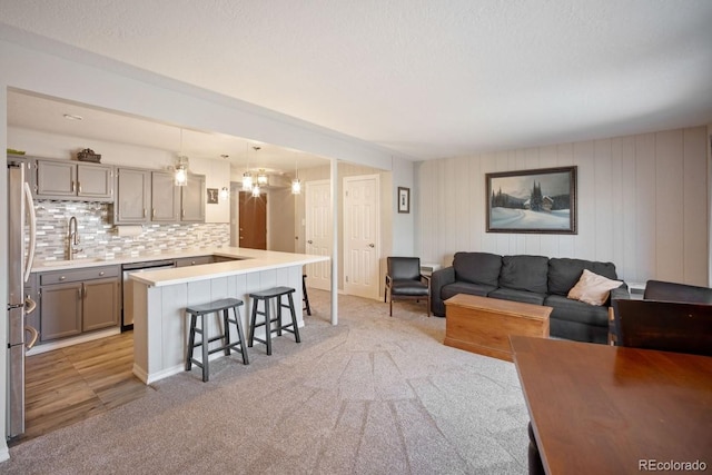 933 Straight Creek Dr Unit 101, Dillon, CO 80435 - living area with light colored carpet and a chandelier
