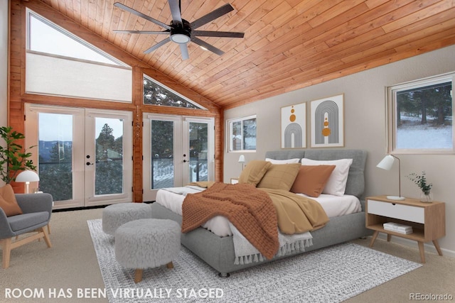 bedroom with wood ceiling, multiple windows, access to outside, and french doors