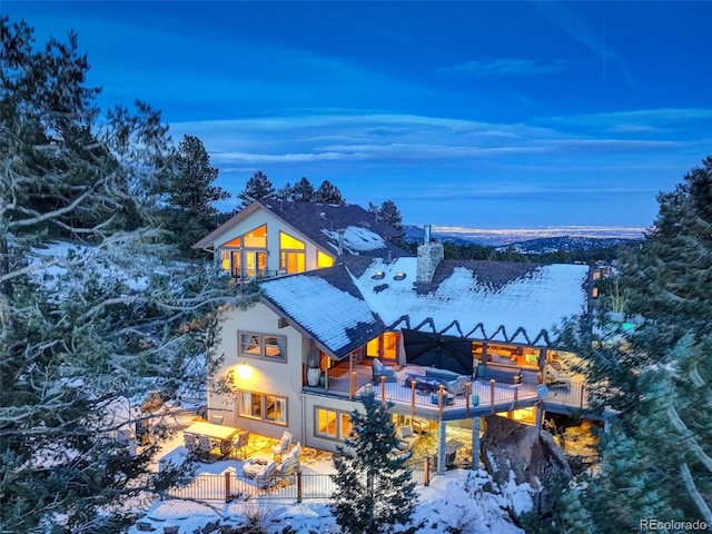 view of snow covered house