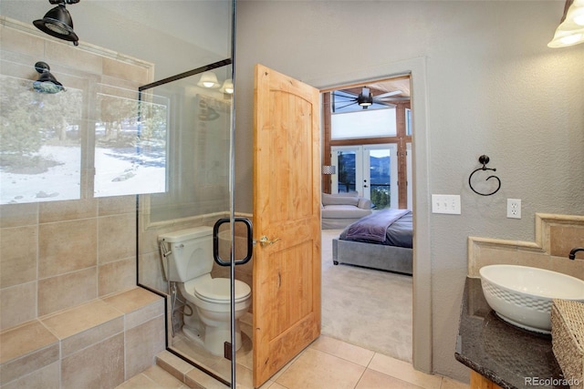 bathroom featuring tile patterned floors, ceiling fan, sink, and plenty of natural light