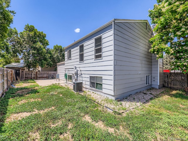 1956 Cathay St, Aurora, CO 80011 - view of home's exterior with a patio and a fenced backyard