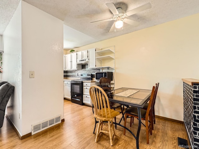 1956 Cathay St, Aurora, CO 80011 - dining room with a textured ceiling, light wood finished floors, and a ceiling fan