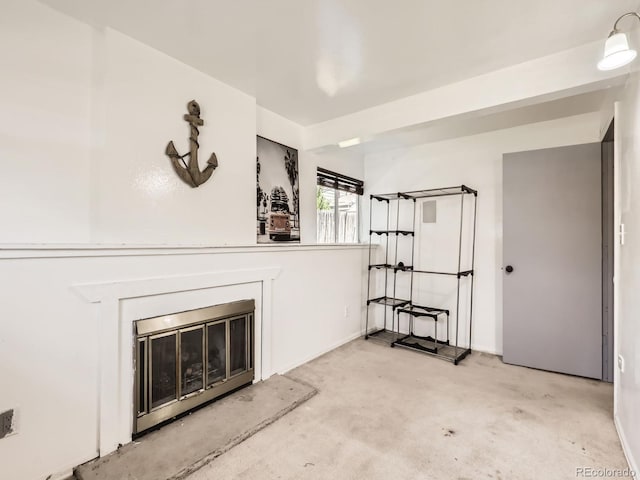 1956 Cathay St, Aurora, CO 80011 - unfurnished living room with a glass covered fireplace and light colored carpet