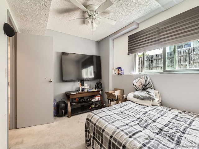 1956 Cathay St, Aurora, CO 80011 - bedroom with carpet, a textured ceiling, and a ceiling fan
