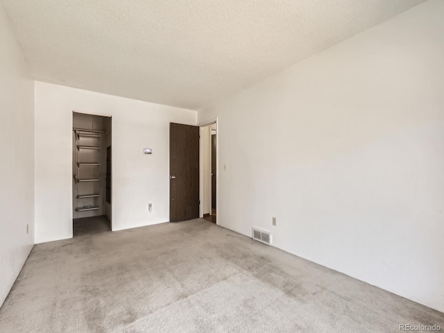 1956 Cathay St, Aurora, CO 80011 - unfurnished room featuring carpet and a textured ceiling