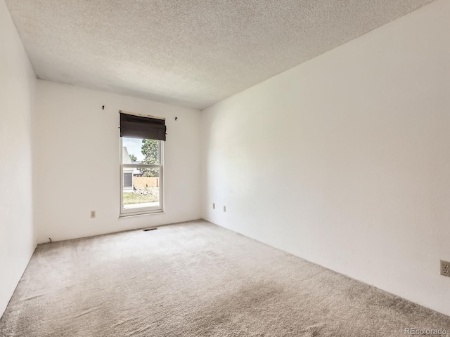 1956 Cathay St, Aurora, CO 80011 - spare room featuring carpet flooring and a textured ceiling