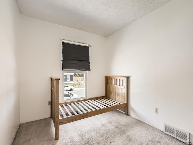 1956 Cathay St, Aurora, CO 80011 - unfurnished bedroom with carpet and a textured ceiling