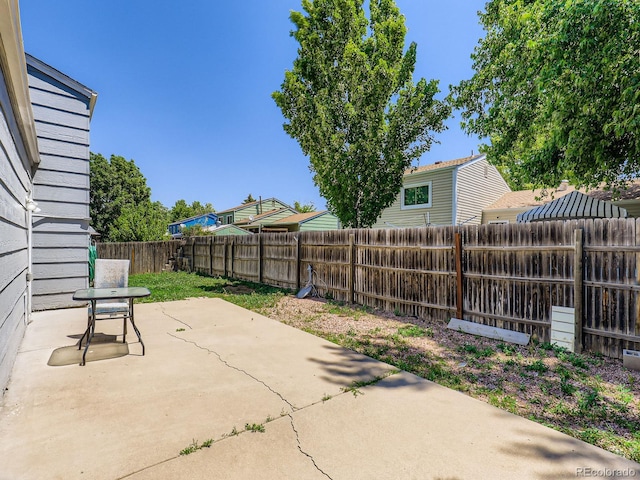 1956 Cathay St, Aurora, CO 80011 - fenced backyard with a patio