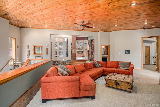 living room featuring light colored carpet, ceiling fan, and wooden ceiling