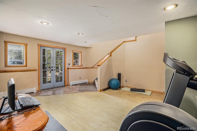 workout area with french doors and a baseboard radiator