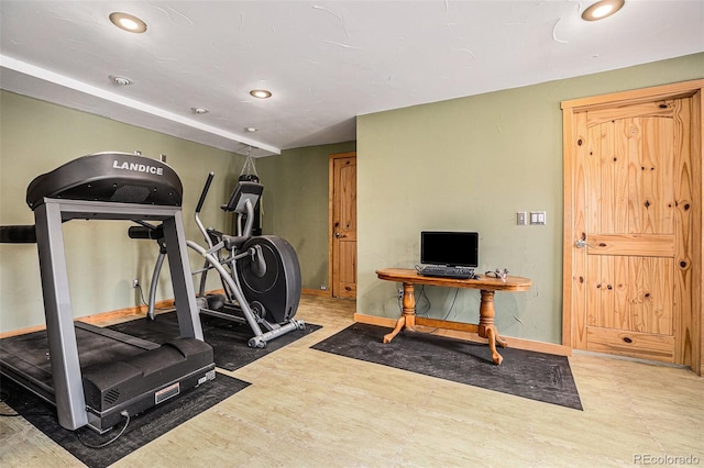 workout area featuring hardwood / wood-style flooring