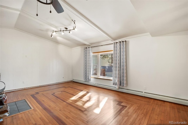 unfurnished room with hardwood / wood-style floors, ceiling fan, a baseboard heating unit, and vaulted ceiling