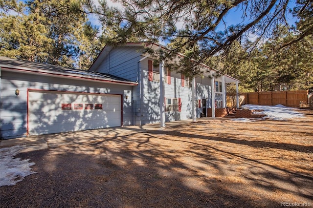 view of property exterior featuring a garage