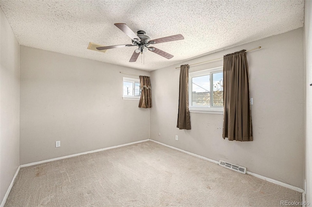 3065 Zion St, Aurora, CO 80011 - carpeted spare room with a textured ceiling, a ceiling fan, and baseboards
