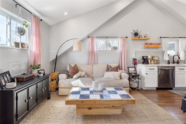 living room with vaulted ceiling, recessed lighting, and wood finished floors