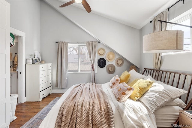 bedroom with wood finished floors, ceiling fan, and vaulted ceiling