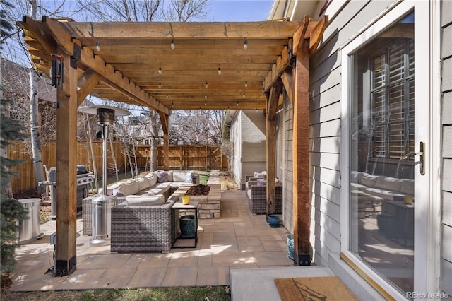 view of patio / terrace with an outdoor living space, a fenced backyard, and grilling area