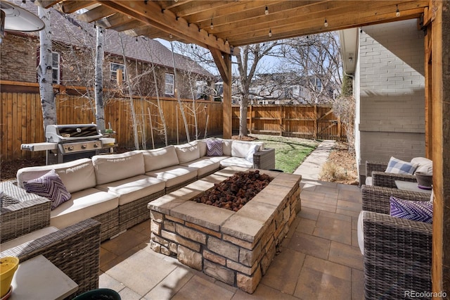 view of patio / terrace featuring grilling area, an outdoor living space, and a fenced backyard