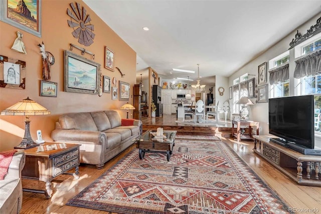 living room with hardwood / wood-style flooring and a chandelier