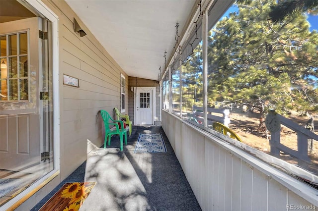 sunroom / solarium with lofted ceiling