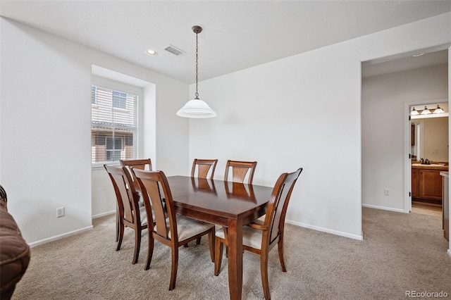 dining room with light carpet, visible vents, recessed lighting, and baseboards