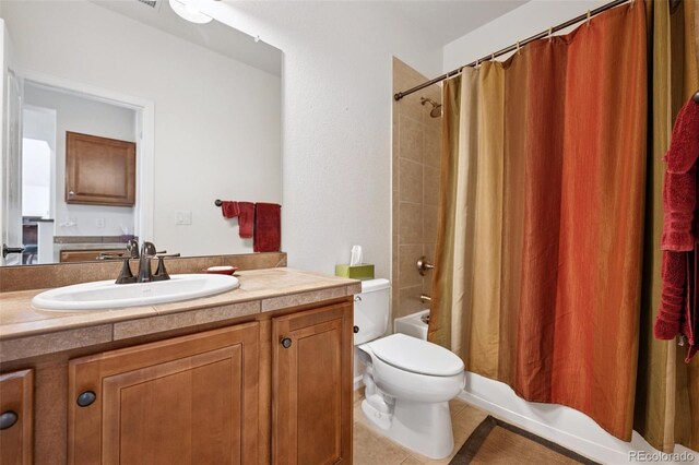 bathroom featuring tile patterned flooring, toilet, vanity, and shower / tub combo with curtain