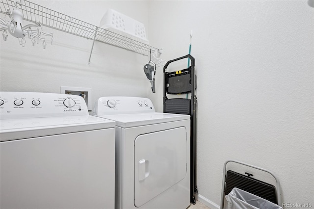 washroom featuring laundry area and washer and clothes dryer