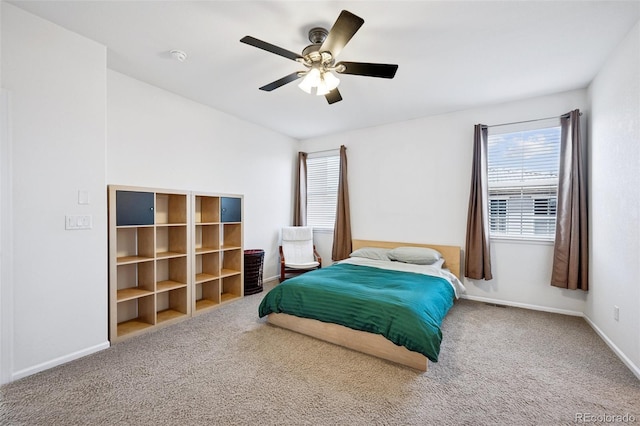 bedroom with baseboards, ceiling fan, and carpet flooring