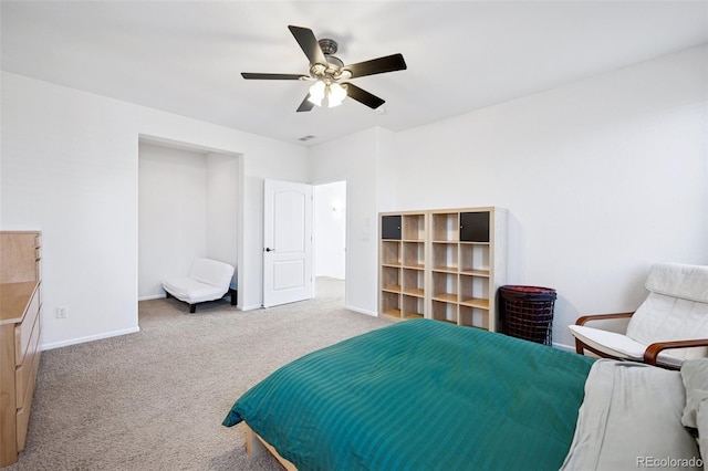 carpeted bedroom featuring a ceiling fan and baseboards