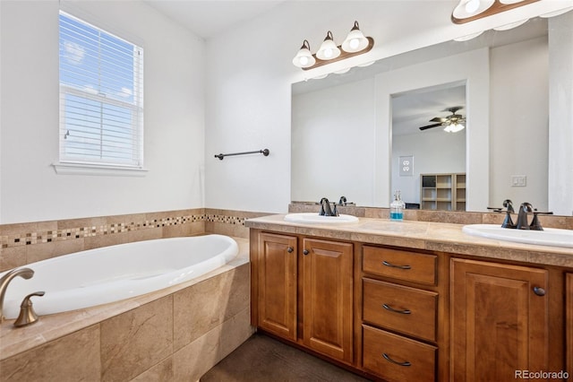 bathroom with a sink, a ceiling fan, a bath, and double vanity