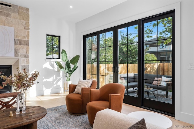 interior space with a fireplace and plenty of natural light