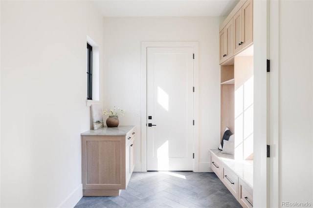 mudroom with parquet flooring