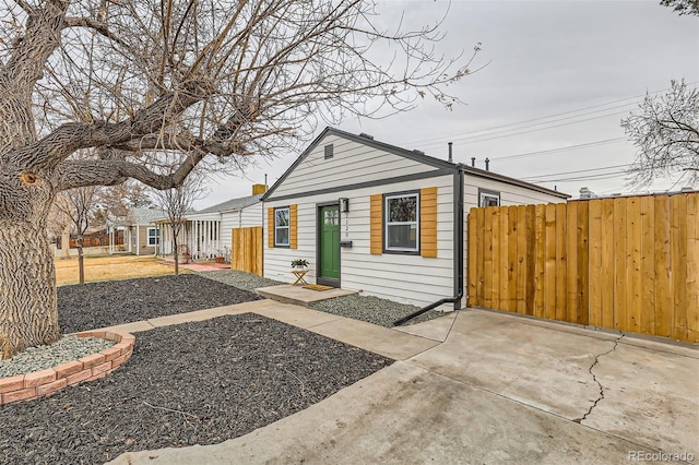 view of front of house with fence