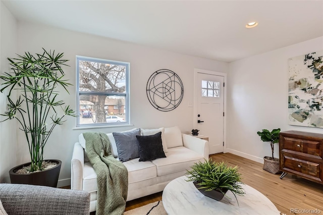 1120 Xenia St, Denver, CO 80220 - living room featuring plenty of natural light, recessed lighting, light wood-type flooring, and baseboards