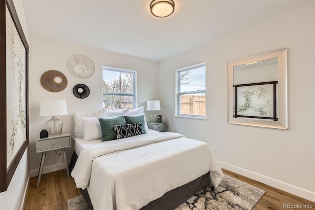 1120 Xenia St, Denver, CO 80220 - bedroom featuring baseboards and wood finished floors