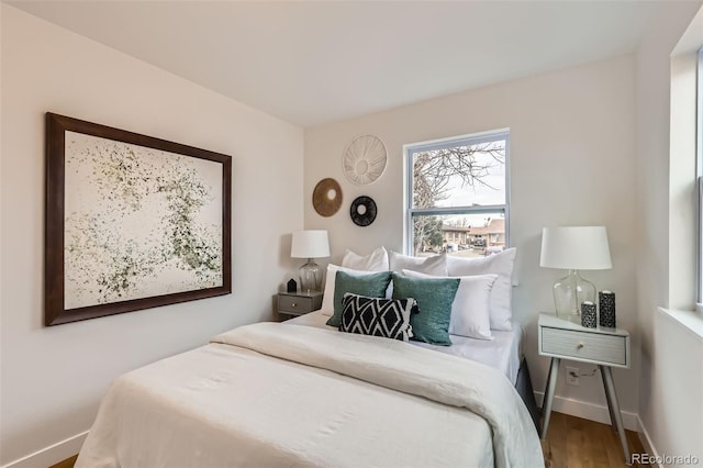 1120 Xenia St, Denver, CO 80220 - bedroom featuring wood finished floors and baseboards