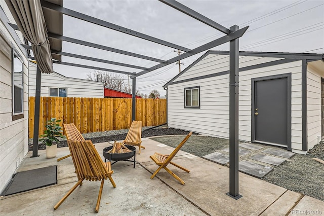 1120 Xenia St, Denver, CO 80220 - view of patio / terrace with a pergola, an outdoor fire pit, and fence