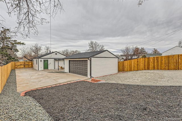 1120 Xenia St, Denver, CO 80220 - view of yard featuring a fenced backyard, a garage, a patio, and an outdoor structure