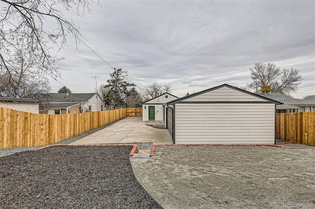 1120 Xenia St, Denver, CO 80220 - view of yard with an outdoor structure, a patio area, and a fenced backyard