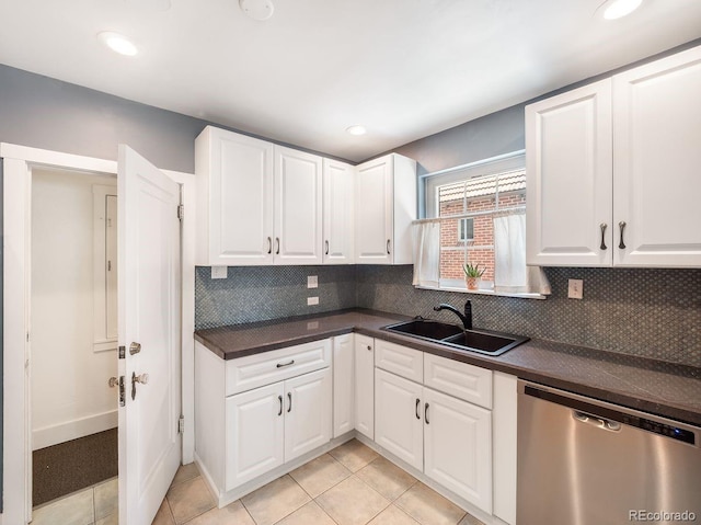 1470 Utica St, Denver, CO 80204 - kitchen featuring dishwasher, dark countertops, decorative backsplash, white cabinets, and recessed lighting