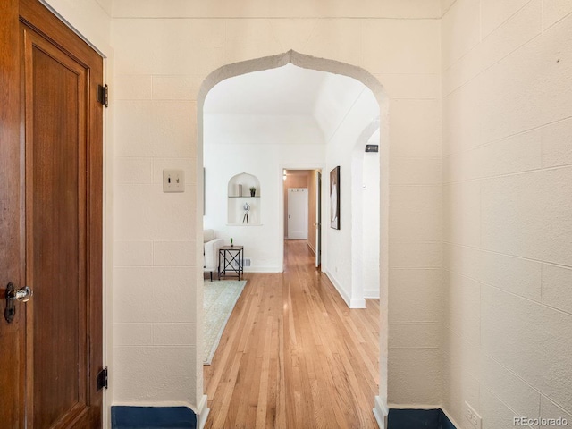 1470 Utica St, Denver, CO 80204 - hall featuring arched walkways and light wood-style flooring
