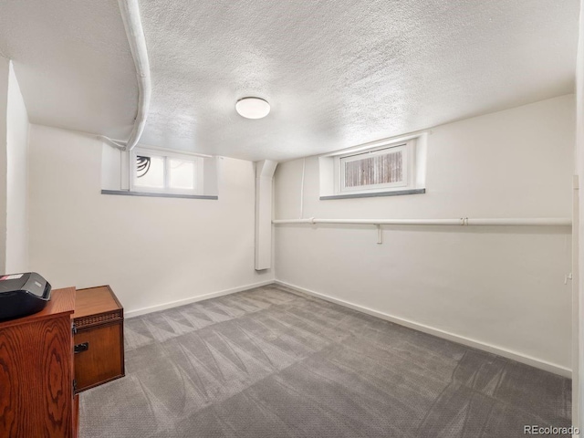 1470 Utica St, Denver, CO 80204 - below grade area featuring carpet flooring and a textured ceiling