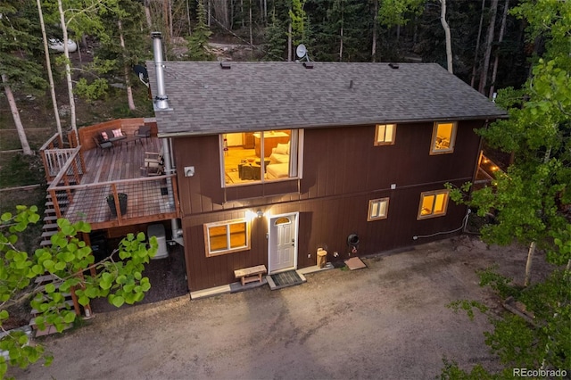 375 Castlewood Dr, Evergreen, CO 80439 - rear view of property with a wooden deck and roof with shingles