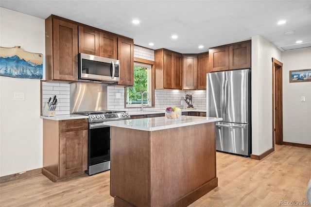 375 Castlewood Dr, Evergreen, CO 80439 - kitchen with stainless steel appliances, light countertops, light wood-style flooring, and recessed lighting
